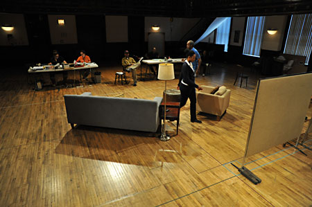Cast and production team prepare for scene