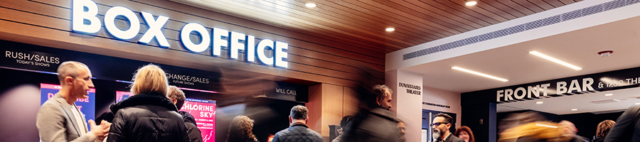 Patrons in the Steppenwolf Lobby under a sign that says Box Office