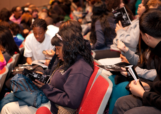 Students await the beginning of the show at the Gary Comer Youth Center
