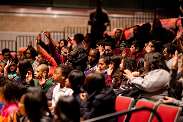 Students respond to questions about taking action in their own communities during the post-show discussion