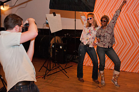 Guests take advantage of the photo station, complete with 70s costume pieces