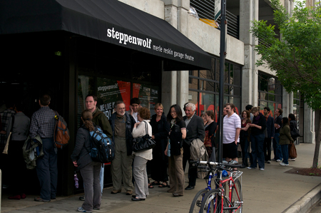 The line to get into the EXPLORE event snakes around the Garage Theatre.