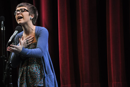 A first-year poet throws herself into her piece.