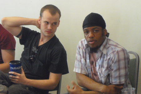 Stephen Louis Grush and ensemble member Jon Michael Hill