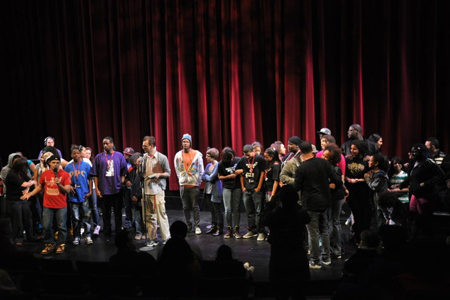 Young Chicago Author’s Robbie Q. Telfer announces the winners of the first slam poetry bout.