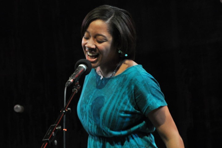 A poet finishes off the day with poetry mixed with song.