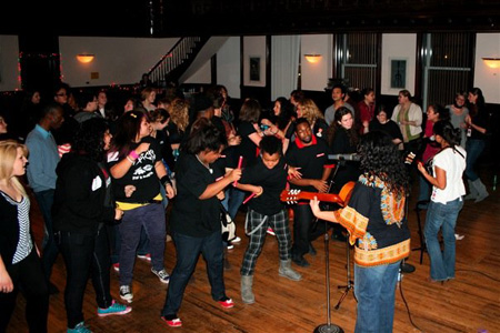 Teens dance to the music from The Luna Blues Machine in Yondorf rehearsal hall. 