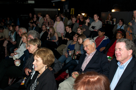 Event attendees watch the performances.