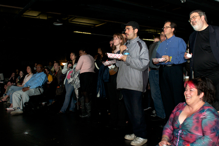 Event attendees watch the performances.