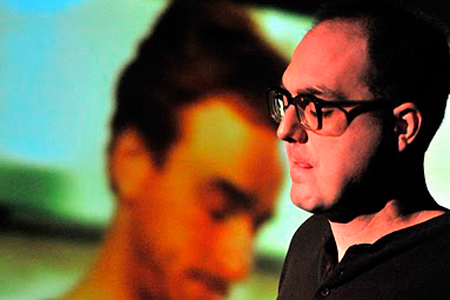 Bernd, (Paige Smith), disconnects with his domestic life at home with Renee, (Patrick Andrews). 