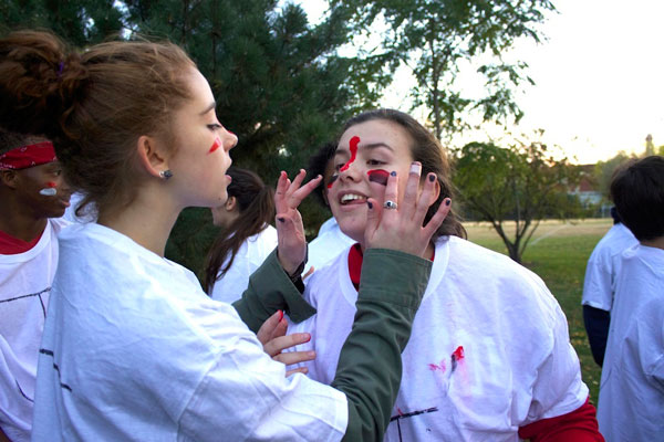 Young Adult Council members Olivia Shine and Molly McGaan get ready for the big game.