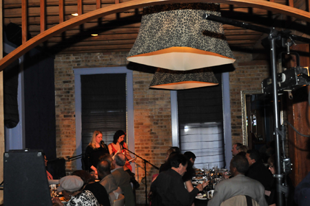 Storytellers Megan Stielstra and Kanisha Foster tell the final story of the night.