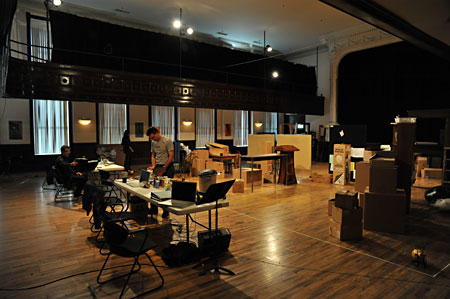 The production team prepares the rehearsal space