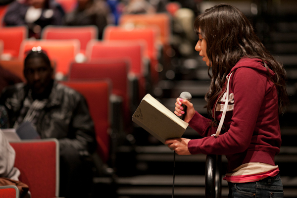 Inspired by what she just saw in the play, a student from North Grand High School shares an original anti-violence poem with the audience, saying, “Together we are a thousand times stronger than them.” 