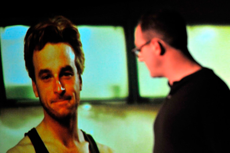 Bernd, (Paige Smith), disconnects with his domestic life at home with Renee, (Patrick Andrews). 