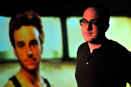 Bernd, (Paige Smith), disconnects with his domestic life at home with Renee, (Patrick Andrews). 