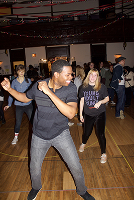 <i>1984</i> cast member Tyrone Phillips dances with guests