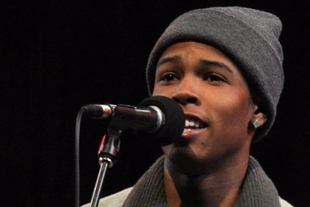 A poet performs his original work.