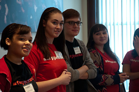 Brittany Stokes, Tam Dickson, Benj Sullivan-Knoff and Karen Valencia listen as their fellow YAC members explain a game that will explore the ideas in the play