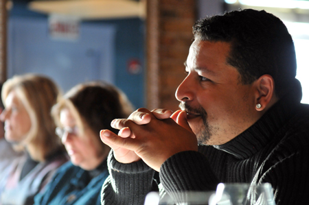 Audience members enjoy dinner and the stories.