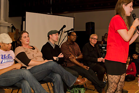 Slam poet and council member Carsen Joenk performs an original piece in front of the cast of Clybourne Park